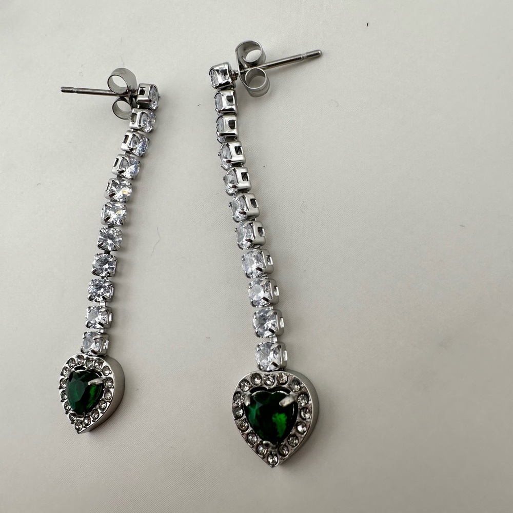 Square Baguette White Diamonds heart shaped earrings . Emerald color heart .